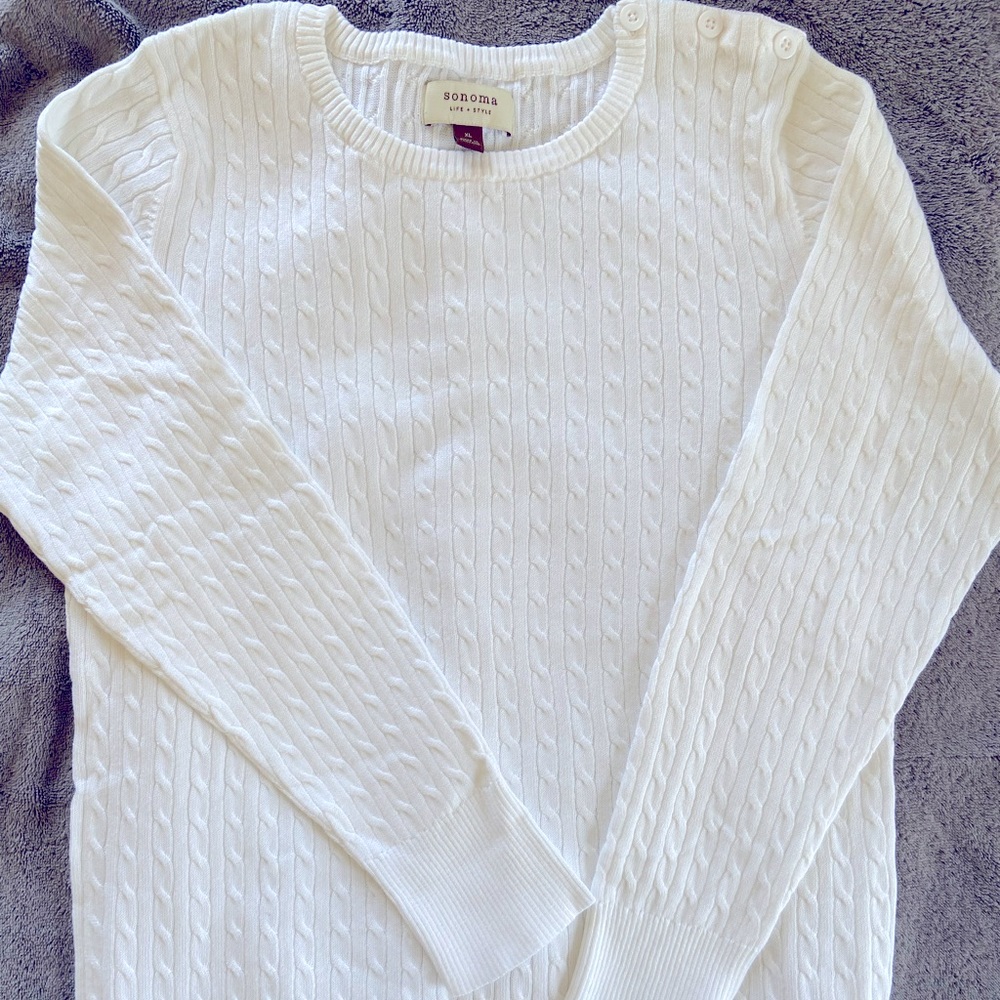 Woman’s white sweater